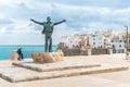 Bronze statue of the Italian singer Domenico Modugno in Polignano a Mare, Bari, Italy