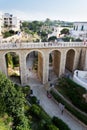 People on the Ponte Lama Monachile bridge in Polignano a Mare, Italy. Royalty Free Stock Photo