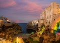 Polignano a mare, Puglia, Italy. August 2021. Incredible aerial view of Cala Monachile: the picturesque and fascinating beach of Royalty Free Stock Photo