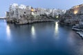 Polignano a Mare, Puglia - Italy. Night at Cala Paura gulf with Bastione di Santo Stefano and Lama Monachile beach on background Royalty Free Stock Photo