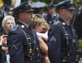 Poliice officer react emotionally at a funeral for an fellowofficer