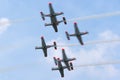 Polish Air Force PZL-Okecie PZL-130 TC-1 Orlik turboprop, single engine, two seat trainer aircraft flying in formation. Royalty Free Stock Photo