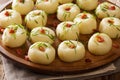 Polish authentic kluski potato dumplings with bacon and green onions close-up on a plate. horizontal Royalty Free Stock Photo