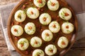 Polish authentic kluski potato dumplings with bacon and green onions close-up on a plate. Horizontal top view Royalty Free Stock Photo