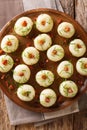 Polish authentic kluski potato dumplings with bacon and green onions close-up on a plate. Vertical top view Royalty Free Stock Photo