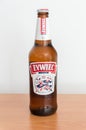 Polish beer Zywiec in 500 ml bottle on wooden table.