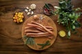Polish kabanos sausages on rustic wood table with natural ingredients Royalty Free Stock Photo