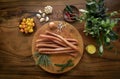 Polish kabanos sausages on rustic wood table with natural ingredients