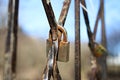 Old rusty padlock closed on the grate