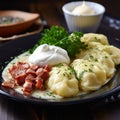 Polish dish pierogi with sour cream 2