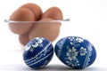 Polish easter eggs with fresh ones in glass cup Royalty Free Stock Photo