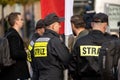 Polish Firefighters, firemen in uniforms standing on the street, group of people. Emergency response services concept, news