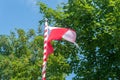 Polish flag flying on flagpole. Polish white and red flag Royalty Free Stock Photo