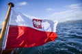 Polish flag waving while sailing on a yacht in the north sea