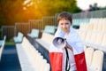 Polish football fan - little boy with megaphone Royalty Free Stock Photo