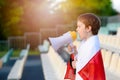 Polish football fan - little boy with megaphone Royalty Free Stock Photo