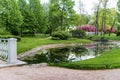 Polish garden at the Derzhavin estate. Gorgeous spring bloom. Pond, bridge