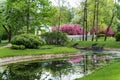 Polish garden at the Derzhavin estate. Gorgeous spring bloom. Pond, bridge