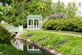 Polish garden at the Derzhavin estate. Gorgeous spring bloom. Pond, bridge Royalty Free Stock Photo