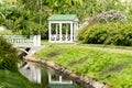 Polish garden at the Derzhavin estate. Gorgeous spring bloom. Pond, bridge