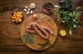 Polish kielbasa sausages on rustic wood table with natural ingredients Royalty Free Stock Photo