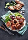 Polish Meat rissoles served with cucumber slices Royalty Free Stock Photo