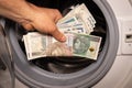 Polish money thrown into the washing machine, Concept, Money laundering, Illegal activity proceeds, Dark business, Black market,