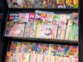 Polish newspaper stand, lots of popular weekly and monthly press releases, many colorful magazines in a row, kiosk, closeup