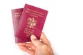 Polish passport held in a man& x27;s hand. Identification document needed in a foreign country