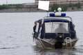 Polish police patrol on the water in the boat .