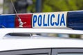 Polish police sign on a roof of police car Royalty Free Stock Photo