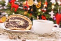 Polish poppy seeds cake, coffee or tea and christmas tree with decoration and hay, Christmas time concept Royalty Free Stock Photo