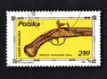 Polish post stamp about ancient pistol. Weapons on the stamp. Isolated stamp