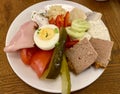 Polish Salad. Egg, Tomato, Pickle, Ham, Cucumber and egg. Polish cuisine.