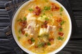 Polish sauerkraut soup Kapusniak with ribs and bacon close-up in a plate. Horizontal top view