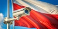 Polish Security Surveillance System A Compositional Study of a CCTV Camera and Flag Demonstrating Rule of Thirds Royalty Free Stock Photo