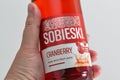 Polish Sobieski Cranberry vodka bottle closeup against white bacground