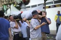 Polish soccer male fans carrying their drunk fellow on the stretcher on the street Royalty Free Stock Photo