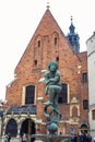 A statue at St. Barbara church in Main Square of Krakow, Poland