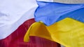 Polish and Ukrainian flag. Helping refugees together against Russia in the war Royalty Free Stock Photo