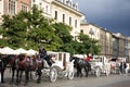 Polish wait and ride horse drawn carriages for Pole people and foreigner travelers use service tour Krakow Old Town in Main Market Royalty Free Stock Photo