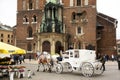 Polish wait and ride horse drawn carriages for Pole people and foreigner travelers use service tour Krakow Old Town in Main Market Royalty Free Stock Photo