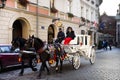 Polish wait and ride horse drawn carriages for Pole people and foreigner travelers use service tour Krakow Old Town in Main Market Royalty Free Stock Photo