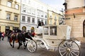 Polish wait and ride horse drawn carriages for Pole people and foreigner travelers use service tour Krakow Old Town in Main Market Royalty Free Stock Photo