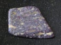 polished Alunite stone on dark background