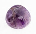 polished Amethyst (purple quartz) gem on white