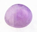 polished Amethyst (violet quartz) gem on white