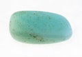 polished aquamarine (blue beryl) stone on white