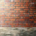 Polished bare concrete floor and red brick wall