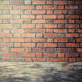 Polished bare concrete floor and red brick wall Royalty Free Stock Photo